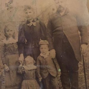 This is John Robert Stewart and his wife Adelaide Delphena Boyde. And three of their children, left to right - Annie, Nellie, and John. Photo submitted by Julie Stewart.